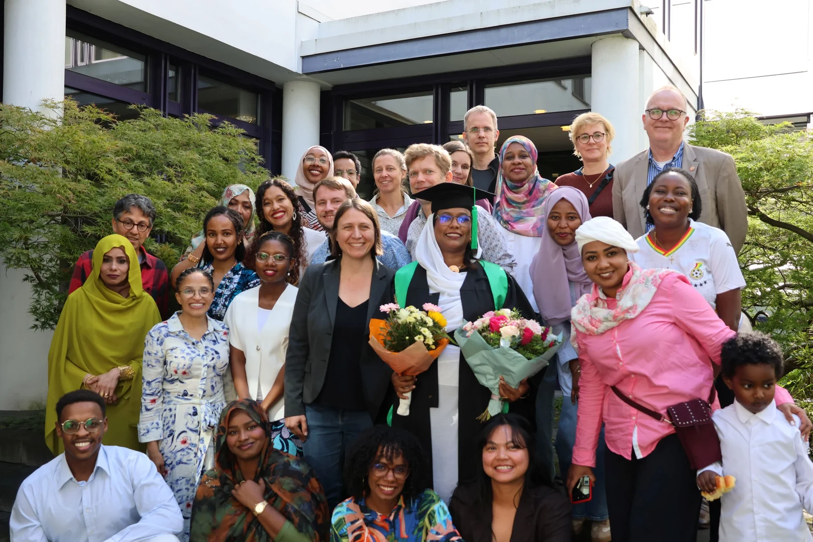 Fatima with ZEF colleagues, family and friends at her graduation ceremony