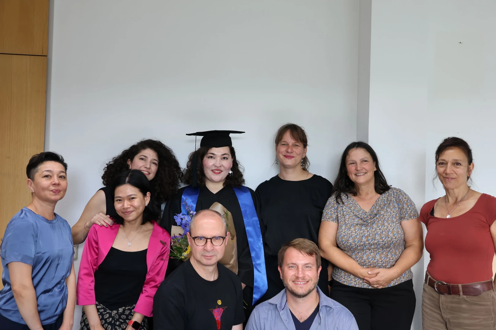 Altynay Kambekova with colleagues, supervisors, family and friends