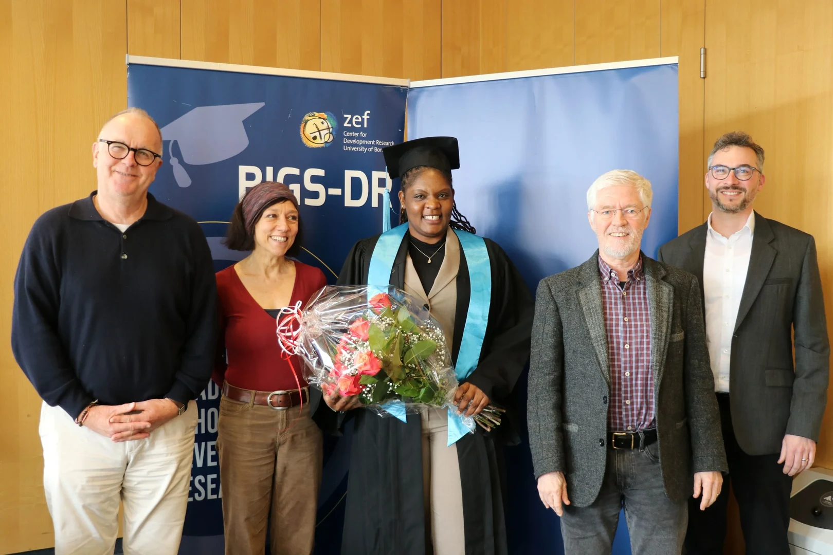 Valentine Opanga (center) with her supervisors and examination committee members